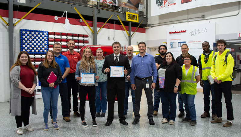 OneEnergy scholarship winners for 2022 stand in Whirlpool Corp's Greenville, Ohio plant with their certificates, standing amongst employees and their families