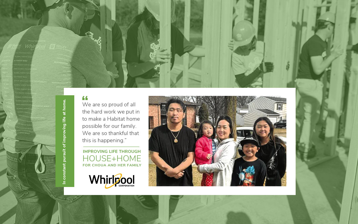 Family from Wisconsin poses and smiles as Whirlpool employees build a home behind them with Habitat for Humanity's BuildBetter with Whirlpool initiative.