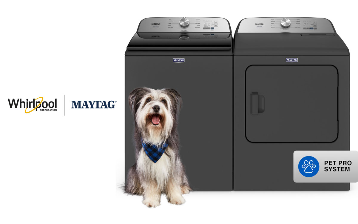 Cute dog sits in front of a washer and dryer, Whirlpool Corp and Maytag brand logos are next to it